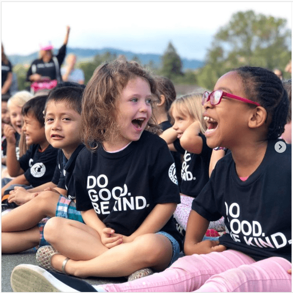 children laughing with "Do good. Be kind" tshirts